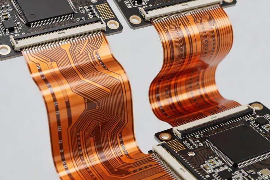 High-density interconnects and board-to-board links using double-sided flex PCBs to connect rigid PCBs with folded flexible circuits