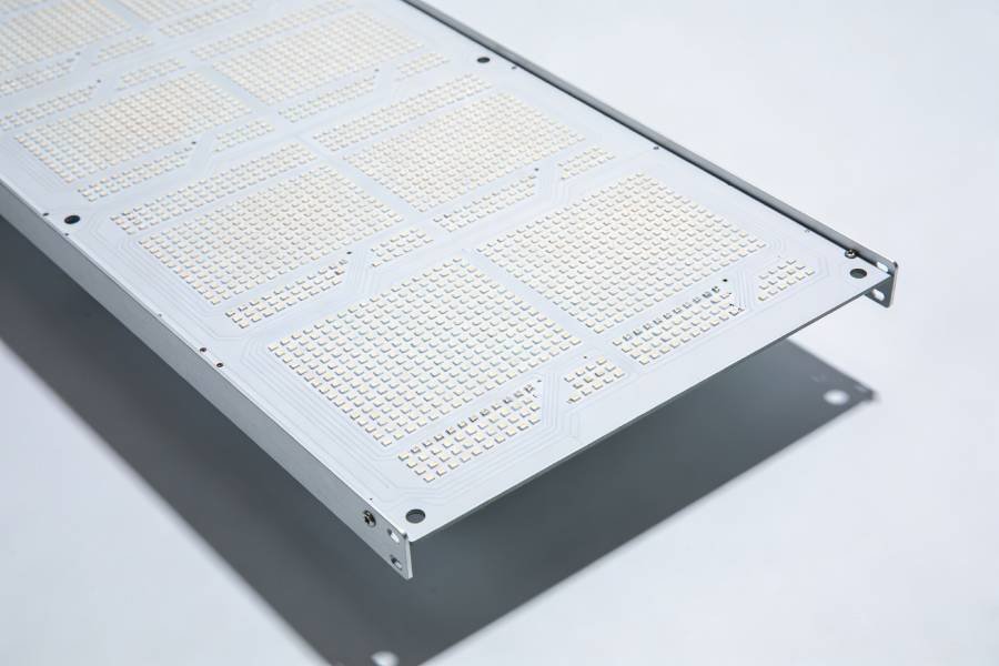 Flat panel-style LED grow light PCB with an array of LED positions on a white surface, representing board-style horticulture lighting designs.