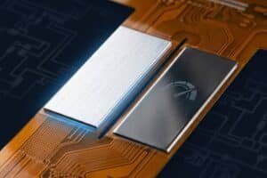 Close-up of a flexible PCB showing aluminum and stainless steel stiffener zones side by side for thermal management and mechanical reinforcement