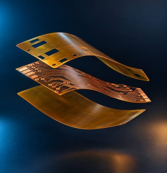 Exploded polyimide flexible PCB material stackup showing coverlay copper circuit and polyimide base film