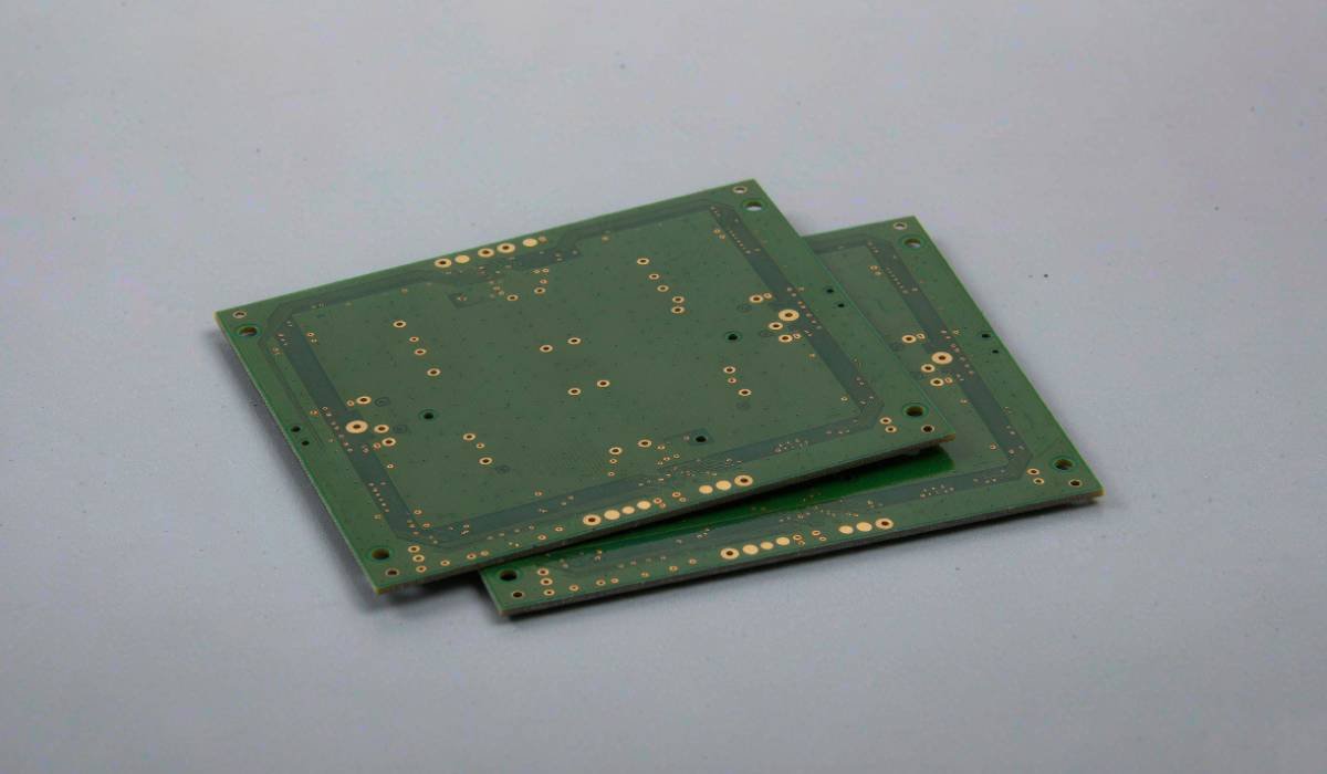 Green rigid bare circuit boards with exposed pads, vias and visible board edges